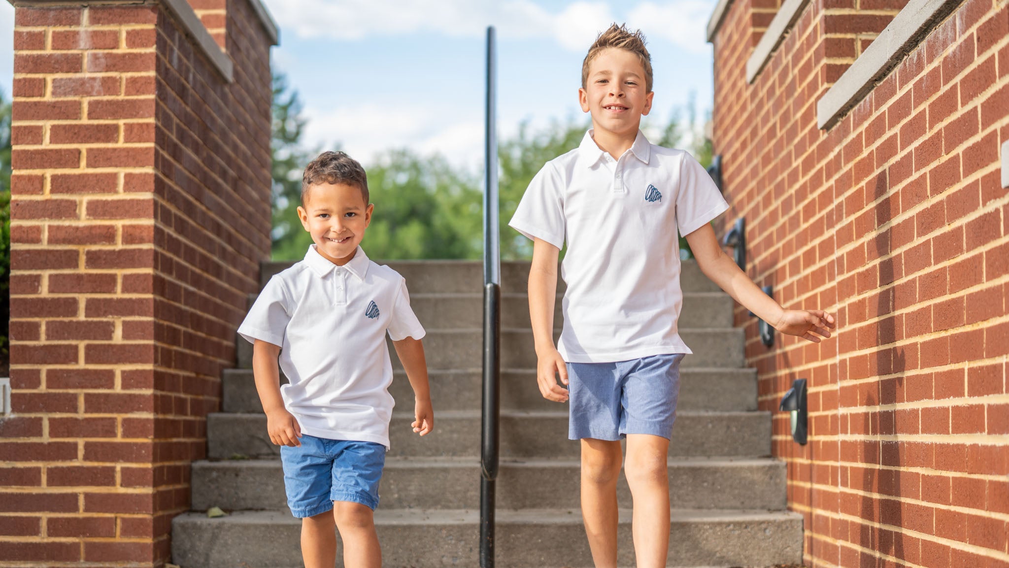 Cam & Coop - The Standard Polo - walking down stairs.